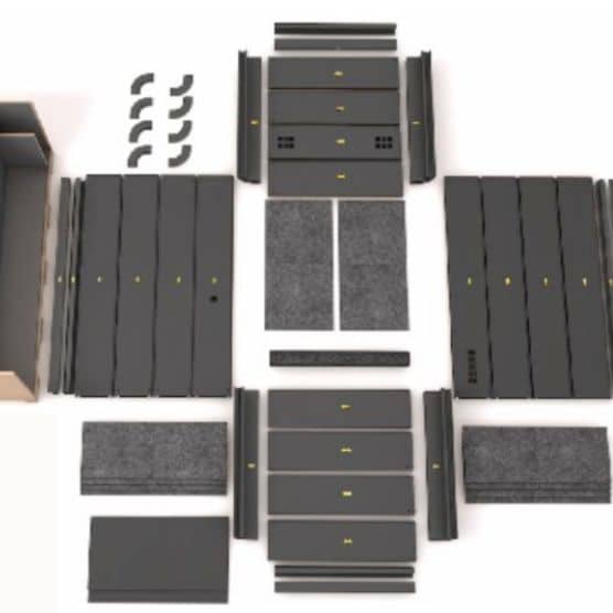 Flat-packed panel components of an 8OOTH booth laid out before assembly