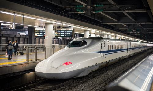 High-speed train arriving at a station platform
