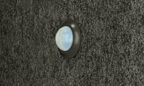 Close-up of an 8OOTH booth's built-in motion sensor on the felt wall panel