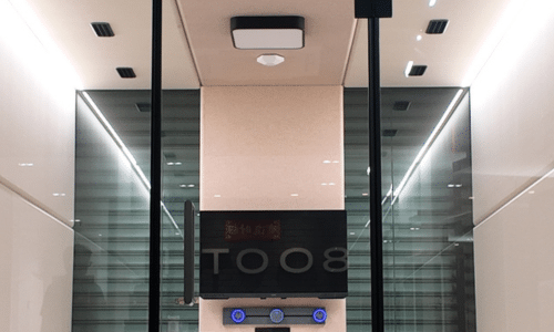 Booth interior with a built-in flatscreen display mounted on the back wall